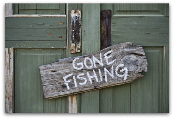 Gone fishing sign on a wooden plaque